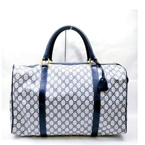 Gucci GG coated canvas duffle bag.